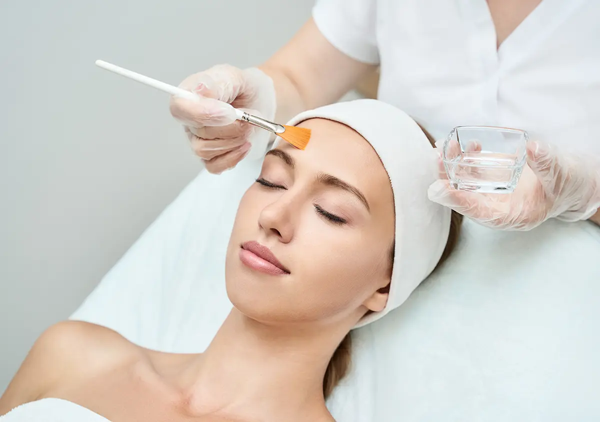 Cosmetology beauty procedure. Young woman skin care. Beautiful female person. Rejuvenation treatment. Facial chemical peel therapy.